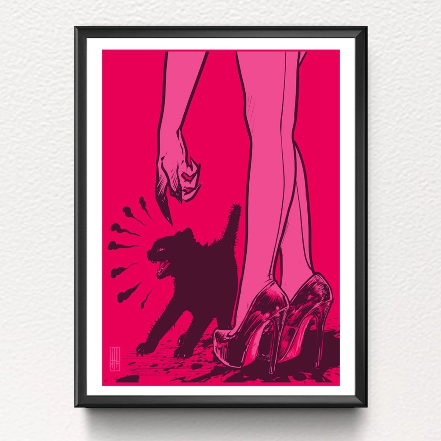 A framed example of Graphic artwork in black pink and red of a pair of ladies legs, wearing high heels with an angry black cat. Frame not included in listing.